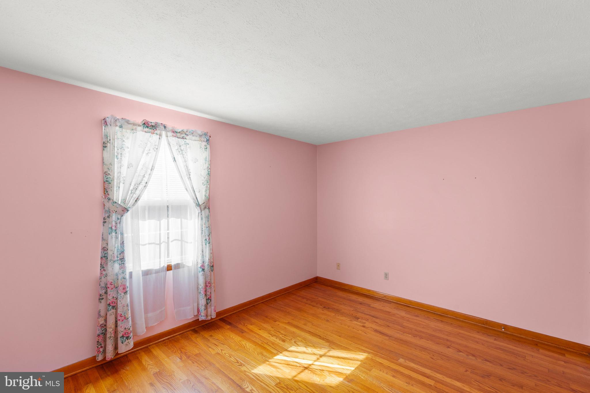 204 Ridge Road Winchester, VA 22602 - Photo 27 of 51 an empty room with wooden floor and windows