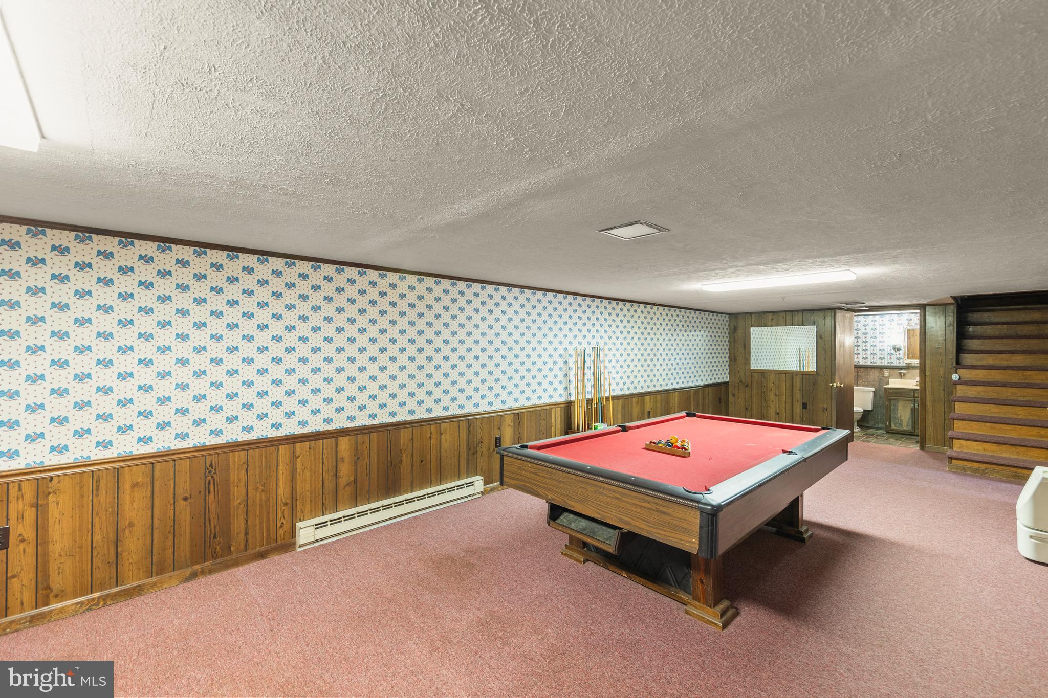 204 Ridge Road Winchester, VA 22602 - Photo 30 of 51 a living room with a table tennis pool table and flat screen tv