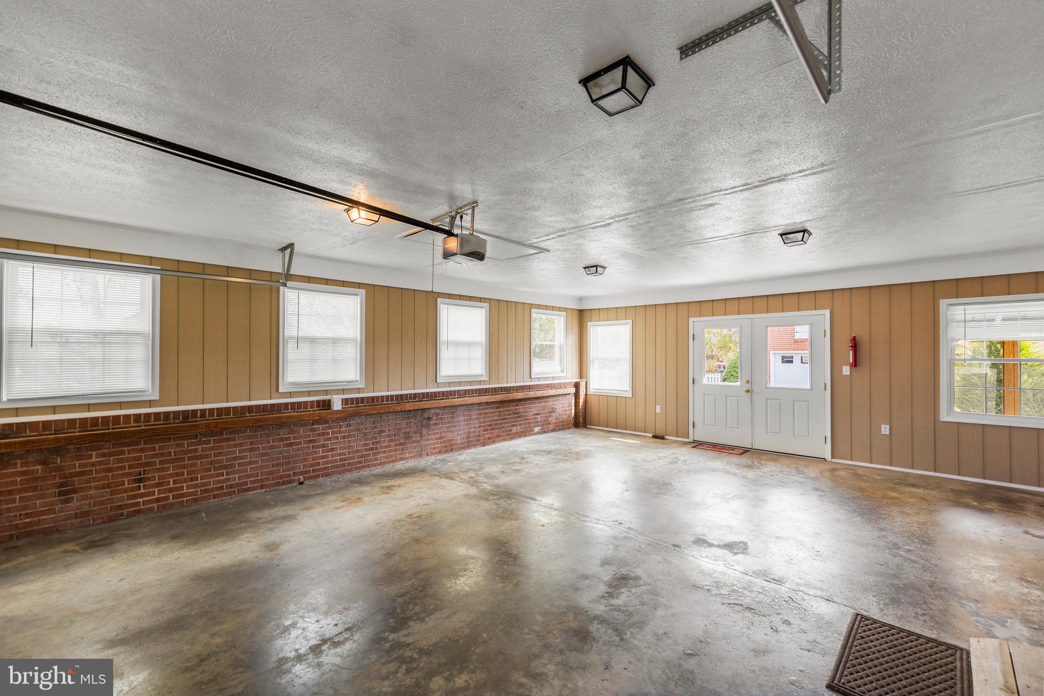 204 Ridge Road Winchester, VA 22602 - Photo 40 of 51 an empty room with wooden floor and windows