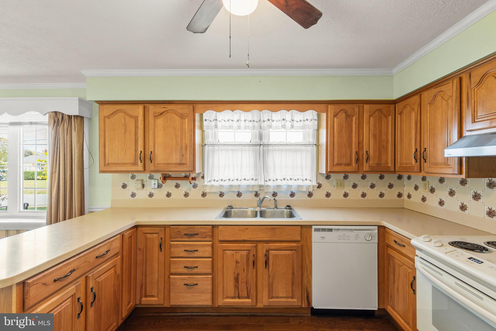 204 Ridge Road Winchester, VA 22602 - Photo 4 of 51 a kitchen with sink cabinets and window
