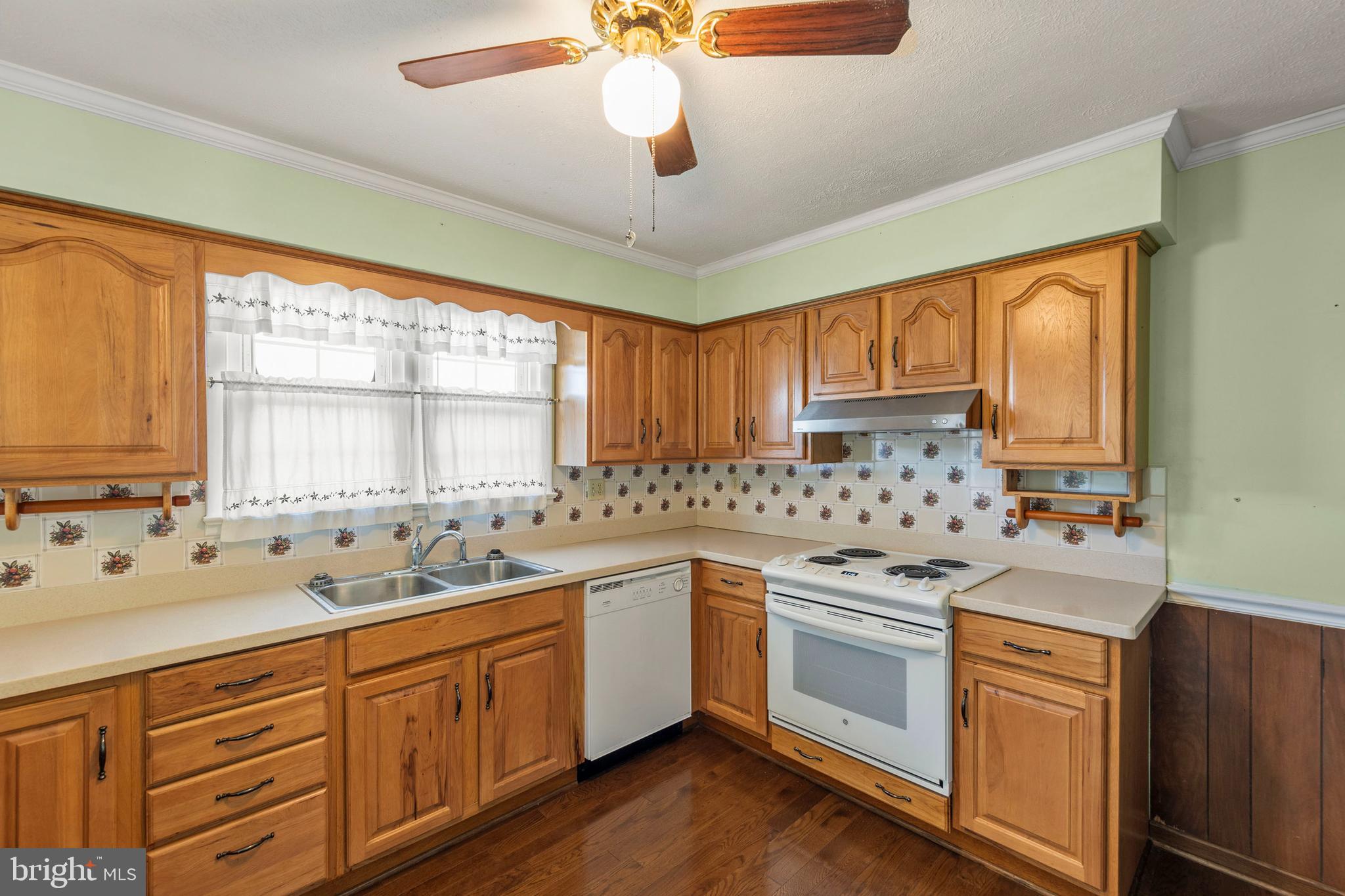 204 Ridge Road Winchester, VA 22602 - Photo 6 of 51 a kitchen with a sink stove and cabinets