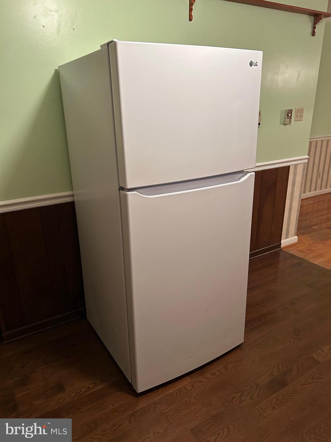 204 Ridge Road Winchester, VA 22602 - Photo 7 of 51 a white refrigerator freezer sitting in a kitchen