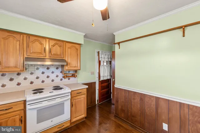 a kitchen with stainless steel appliances a stove a sink and a refrigerator