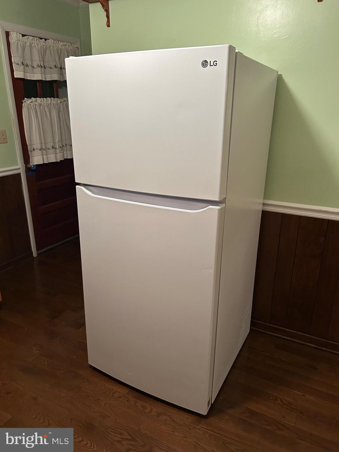 204 Ridge Road Winchester, VA 22602 - Photo 10 of 51 a white refrigerator freezer sitting in a kitchen