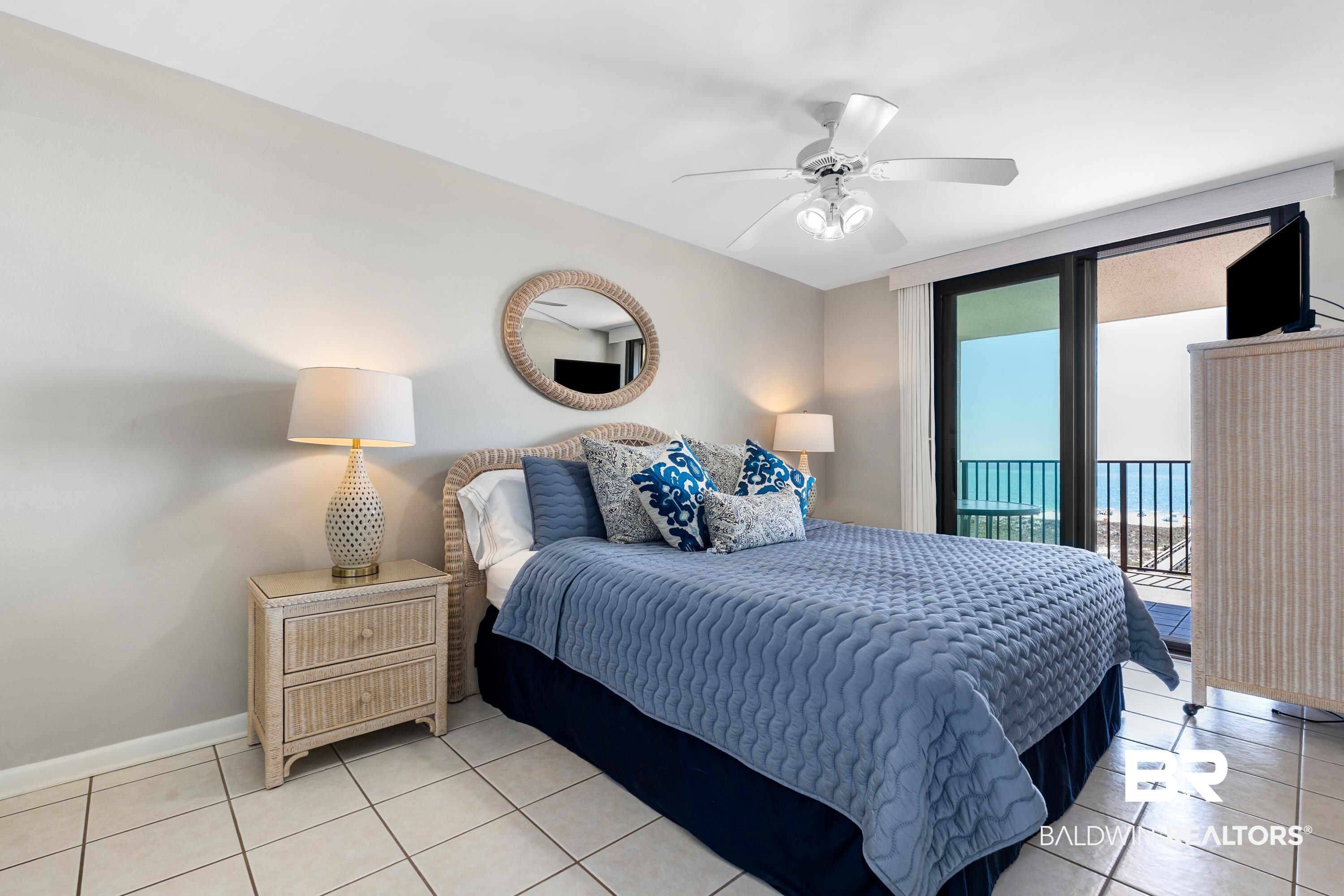 26802 Perdido Beach Boulevard, Unit 406 Orange Beach, AL 36561 - Photo 11 of 37 Bedroom with access to outside, ceiling fan, and light tile patterned floors