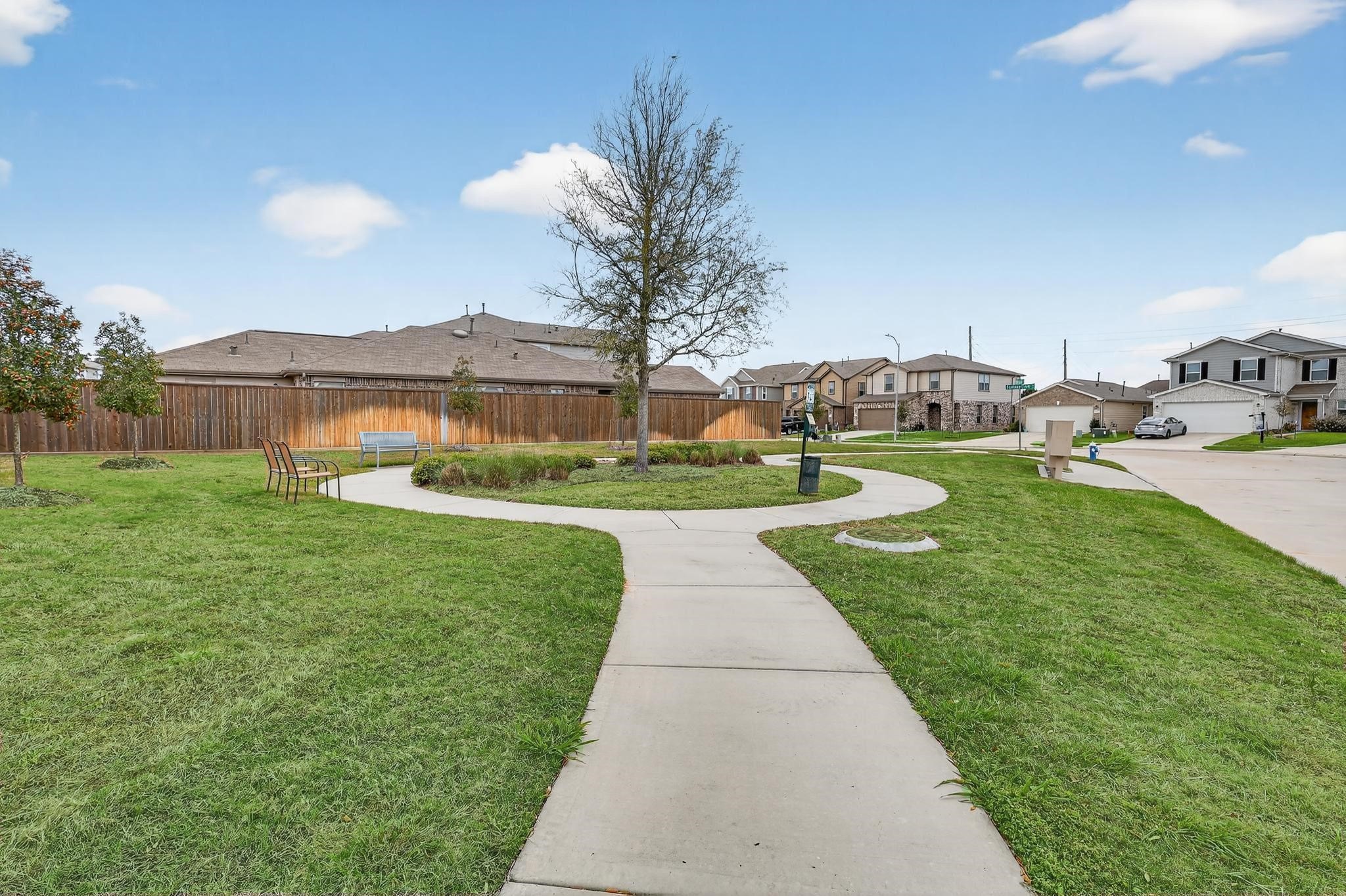 3322 Nila Creek Dr Spring Spring, TX 77373 - Photo 35 of 36 Neighborhood walking trail and green space providing a scenic area for outdoor recreation and community enjoyment.