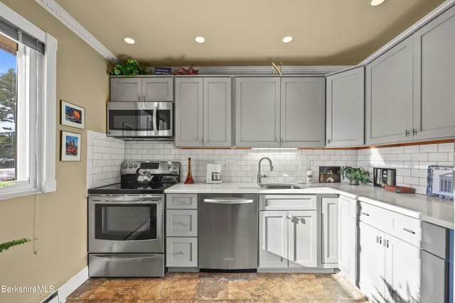 a workspace with furniture and a potted plant