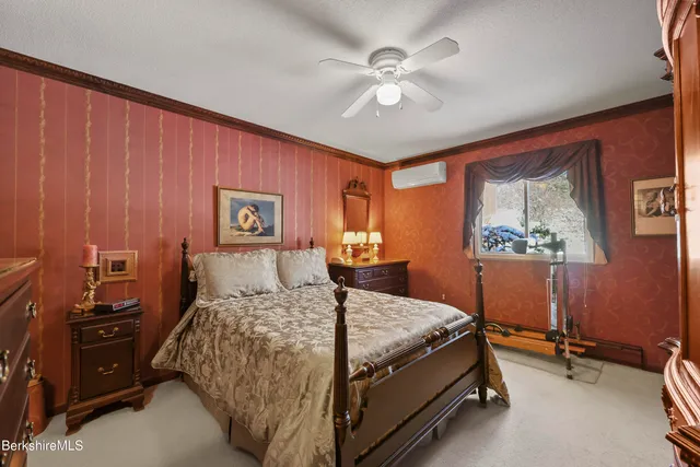 a bed room with a bed and a chandelier