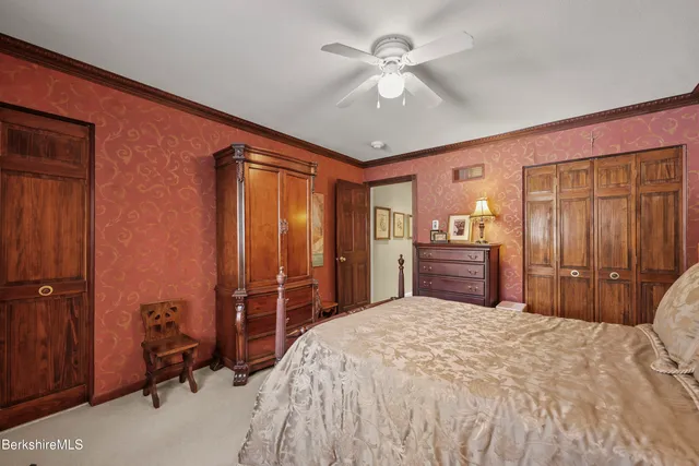 a living room with a couch and a book shelf