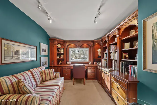 a reading room with furniture and book shelf