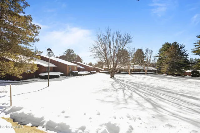a view of a porch with furniture and front door