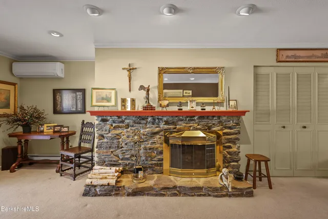 a living room with furniture a lamp and a window