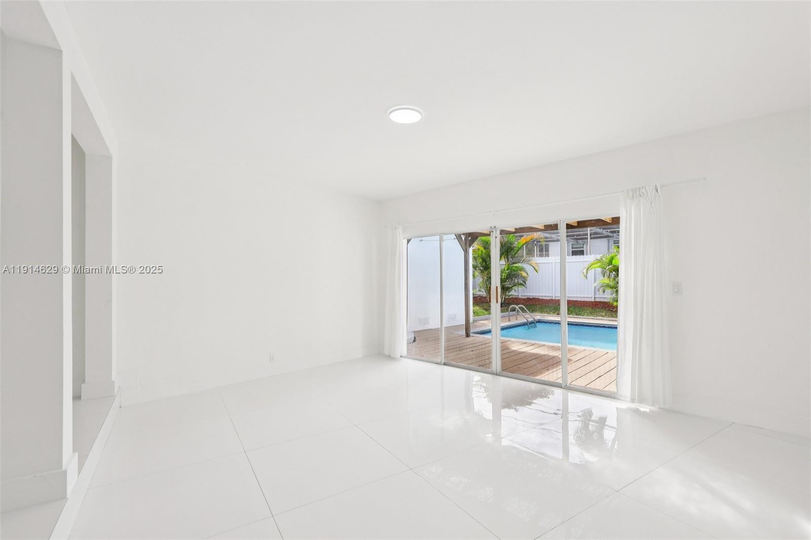 12630 Northeast Miami Place North Miami, FL 33161 - Photo 23 of 66 a view of an empty room with a window