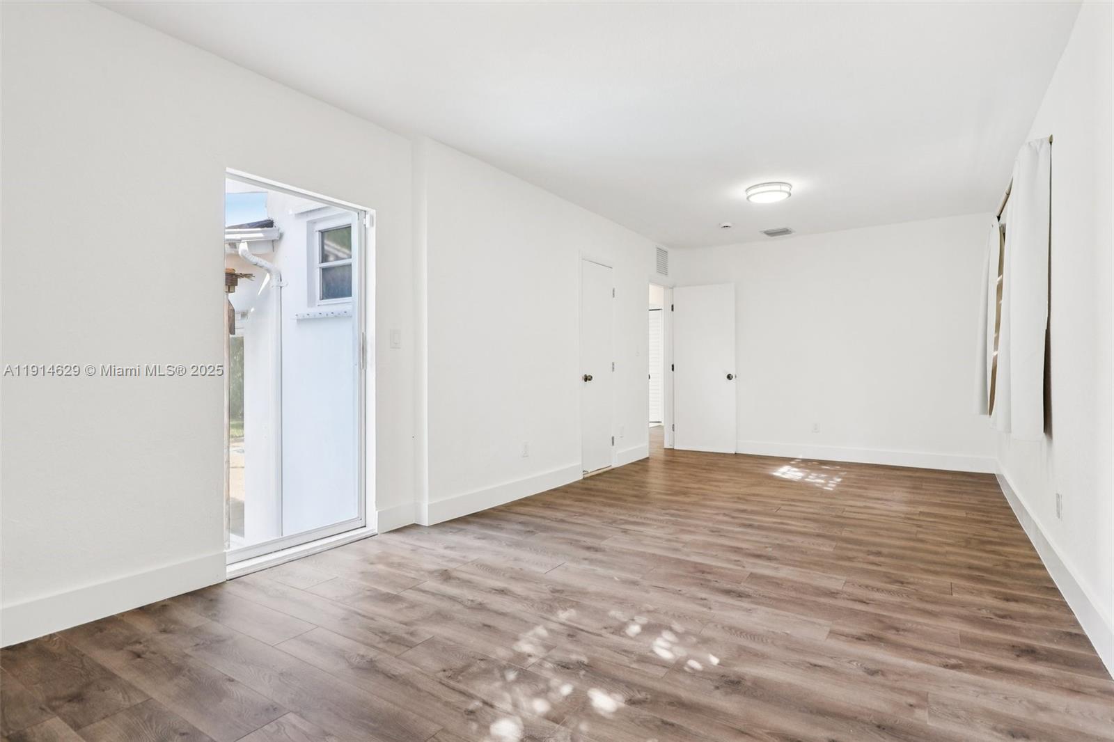 12630 Northeast Miami Place North Miami, FL 33161 - Photo 29 of 66 wooden floor in an empty room
