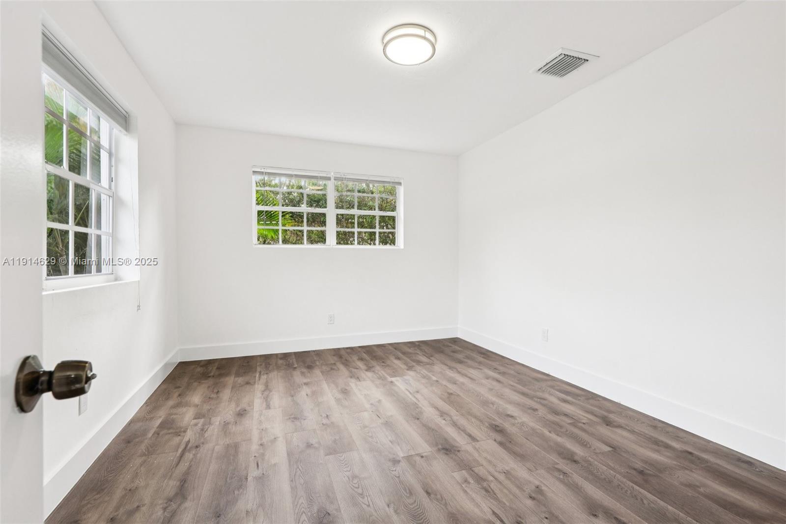 12630 Northeast Miami Place North Miami, FL 33161 - Photo 48 of 66 an empty room with a window