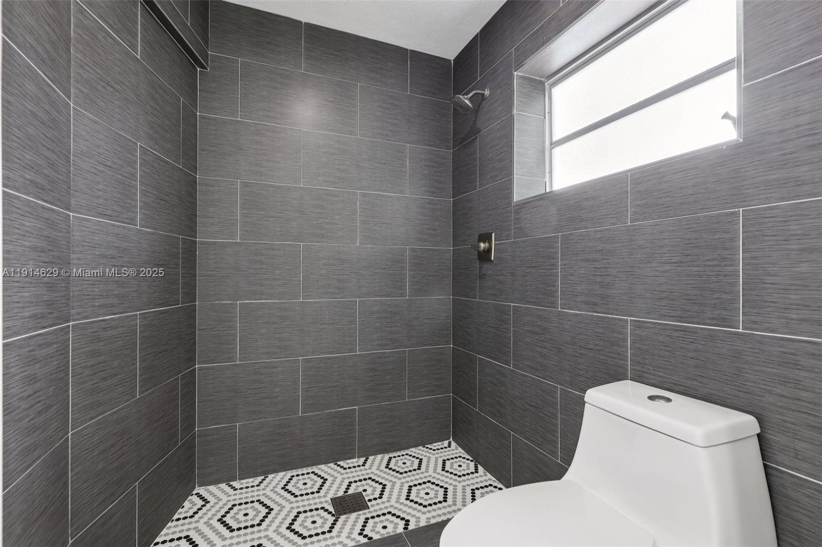 12630 Northeast Miami Place North Miami, FL 33161 - Photo 55 of 66 a bathroom with a toilet and a shower