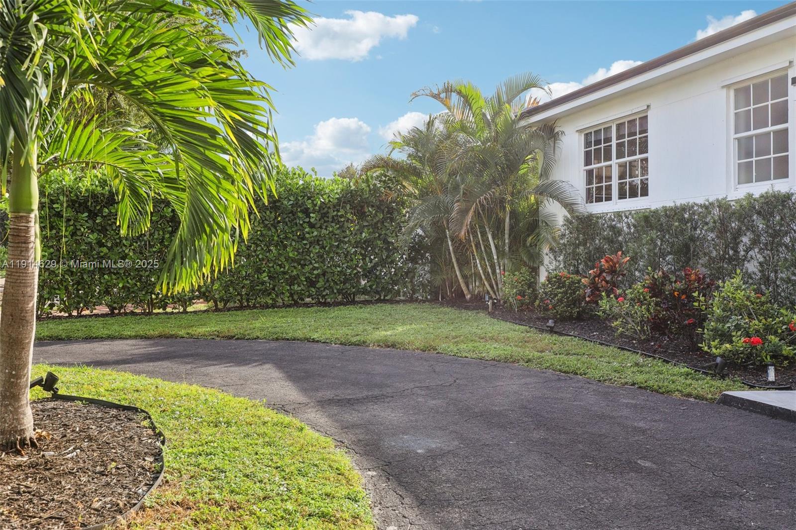 12630 Northeast Miami Place North Miami, FL 33161 - Photo 6 of 66 a view of a backyard with plants and trees