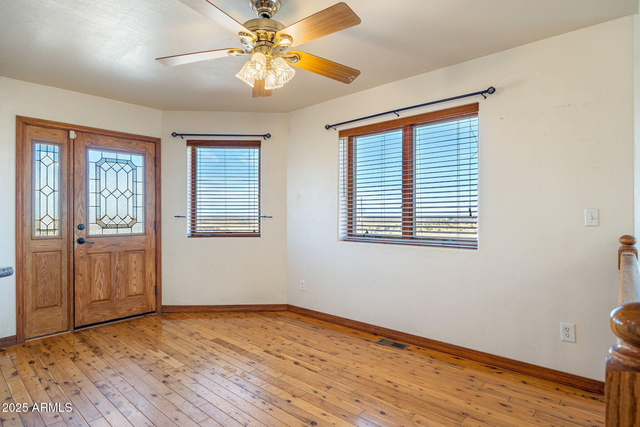 800 Arena Estates Taylor, AZ 85939 - Photo 12 of 50 wooden floor in an empty room with a window