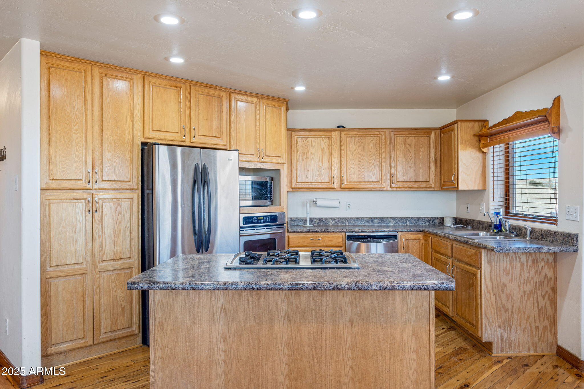 800 Arena Estates Taylor, AZ 85939 - Photo 17 of 50 a kitchen with granite countertop a refrigerator and a sink