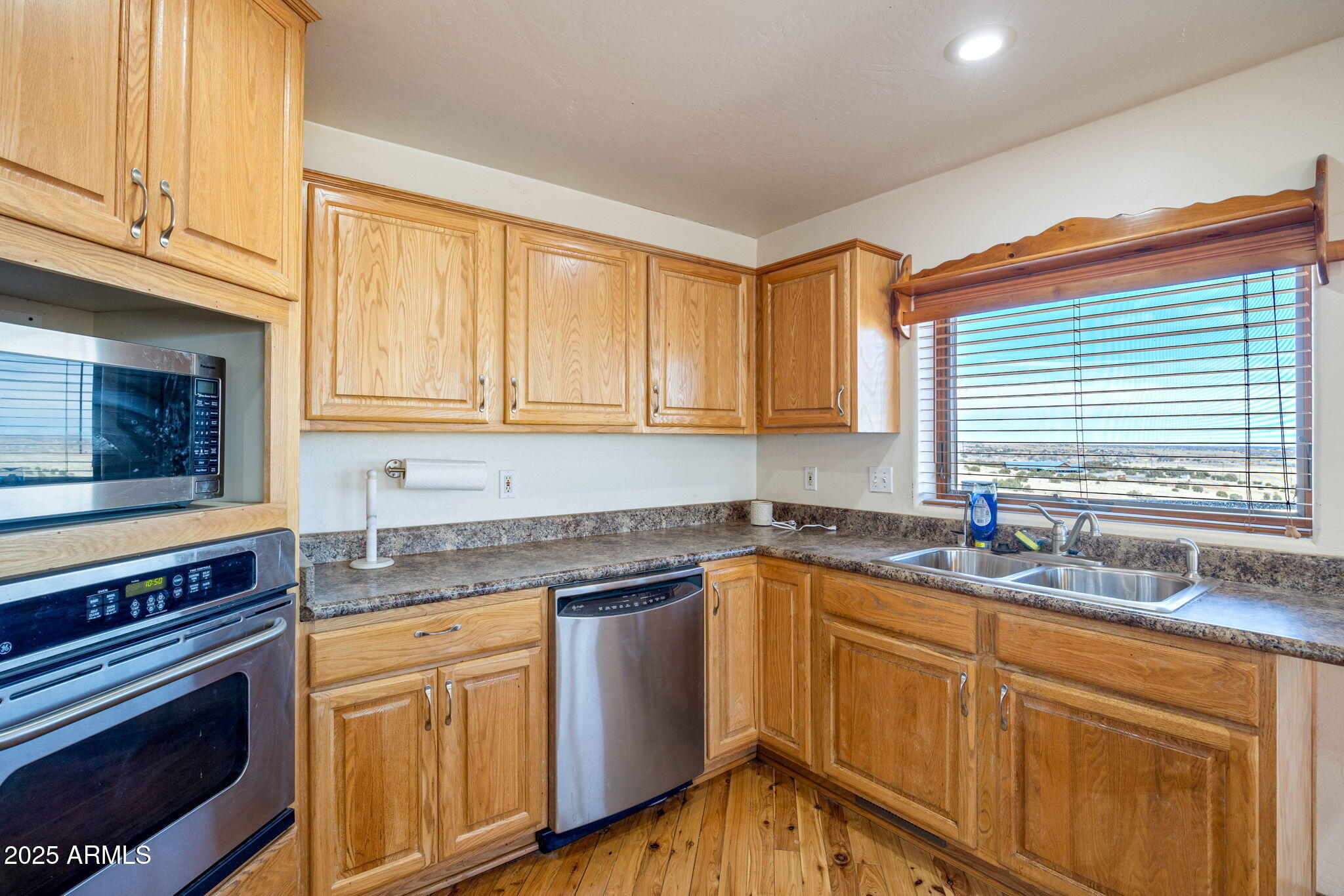 800 Arena Estates Taylor, AZ 85939 - Photo 18 of 50 a kitchen with granite countertop cabinets stainless steel appliances a sink and window