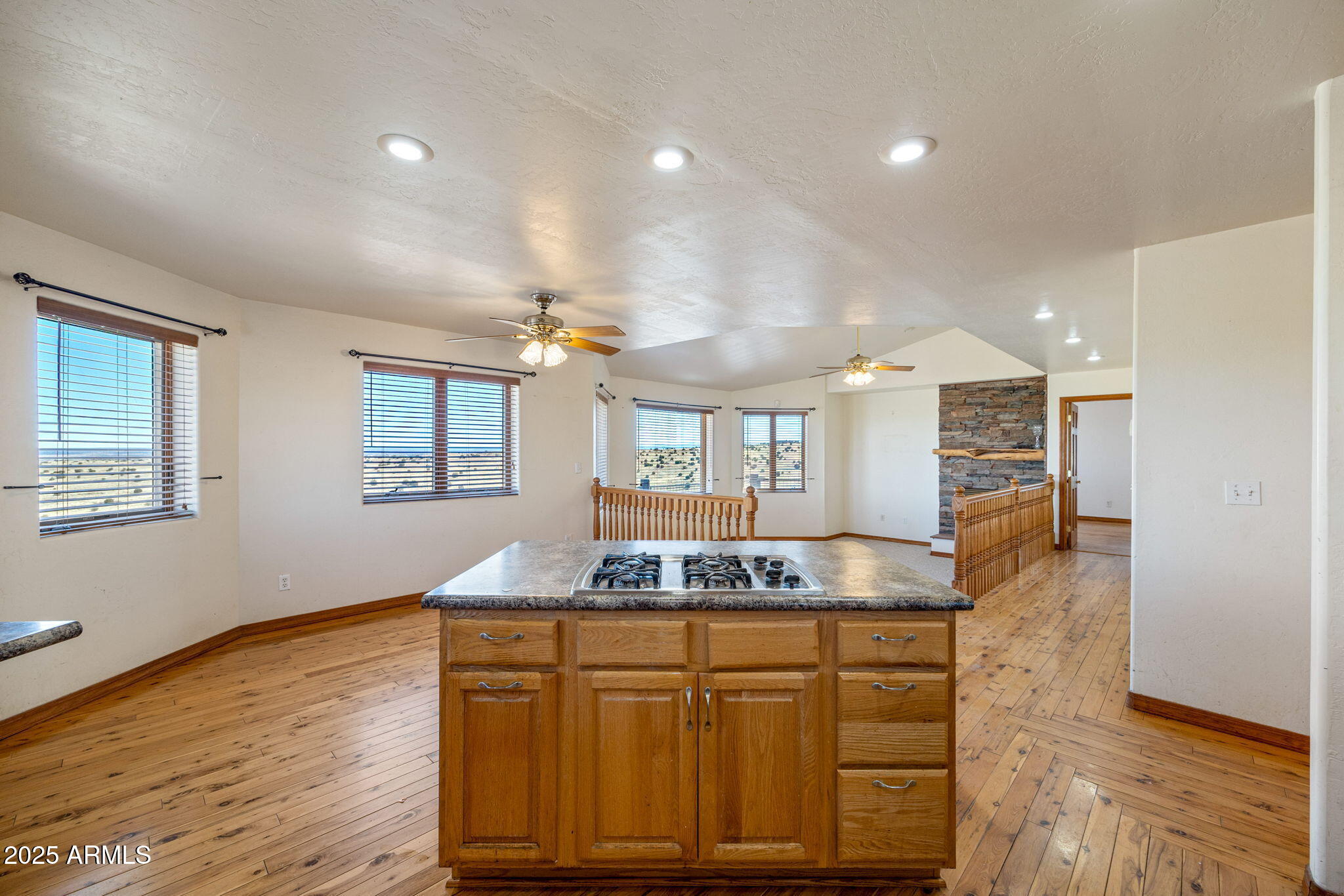800 Arena Estates Taylor, AZ 85939 - Photo 19 of 50 a kitchen with granite countertop cabinets and wooden floor