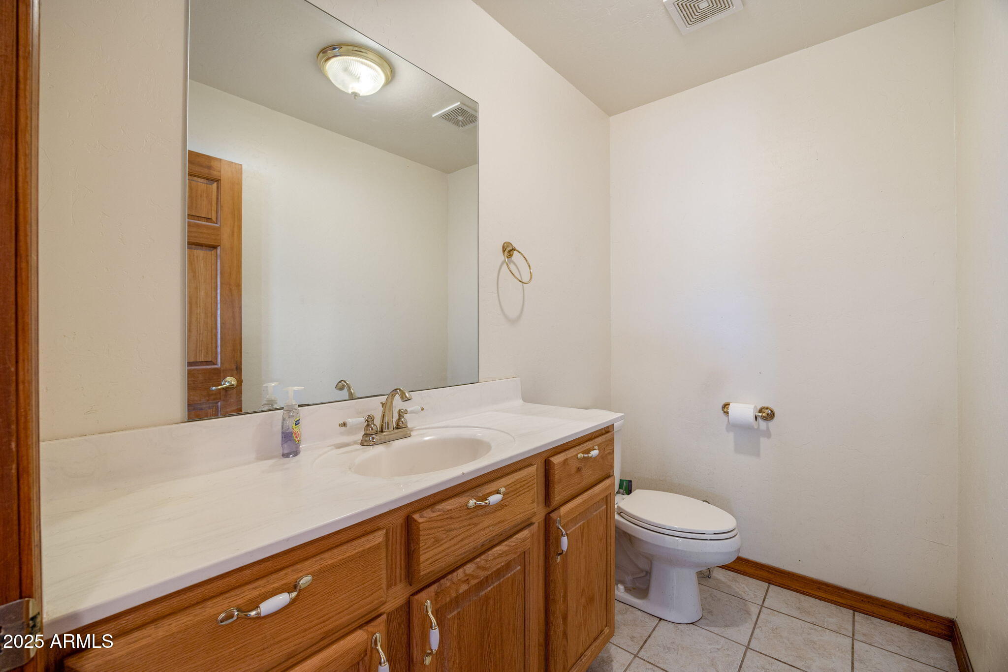 800 Arena Estates Taylor, AZ 85939 - Photo 20 of 50 a bathroom with a sink a toilet and mirror