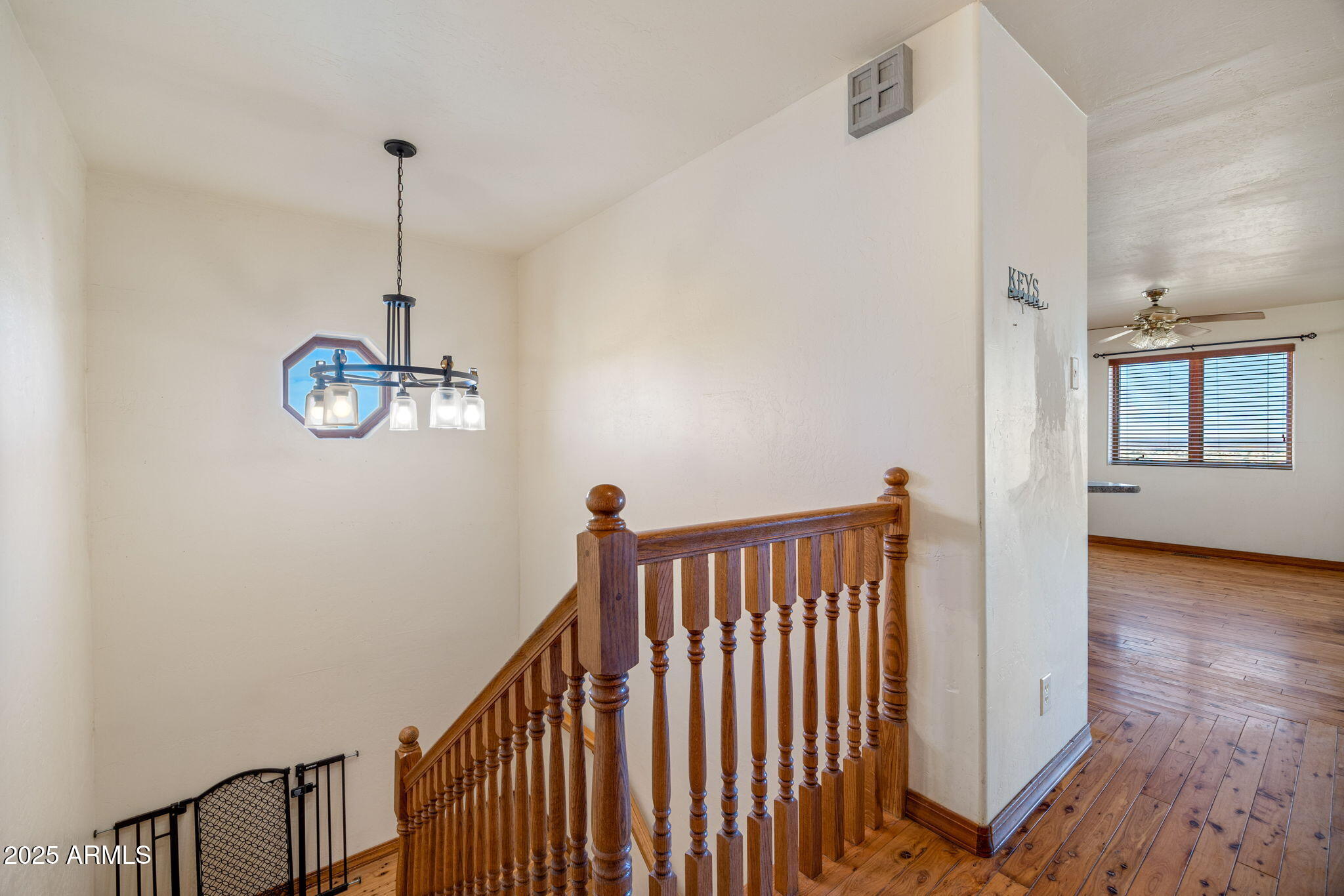 800 Arena Estates Taylor, AZ 85939 - Photo 28 of 50 a view of a hallway with wooden floor and a window