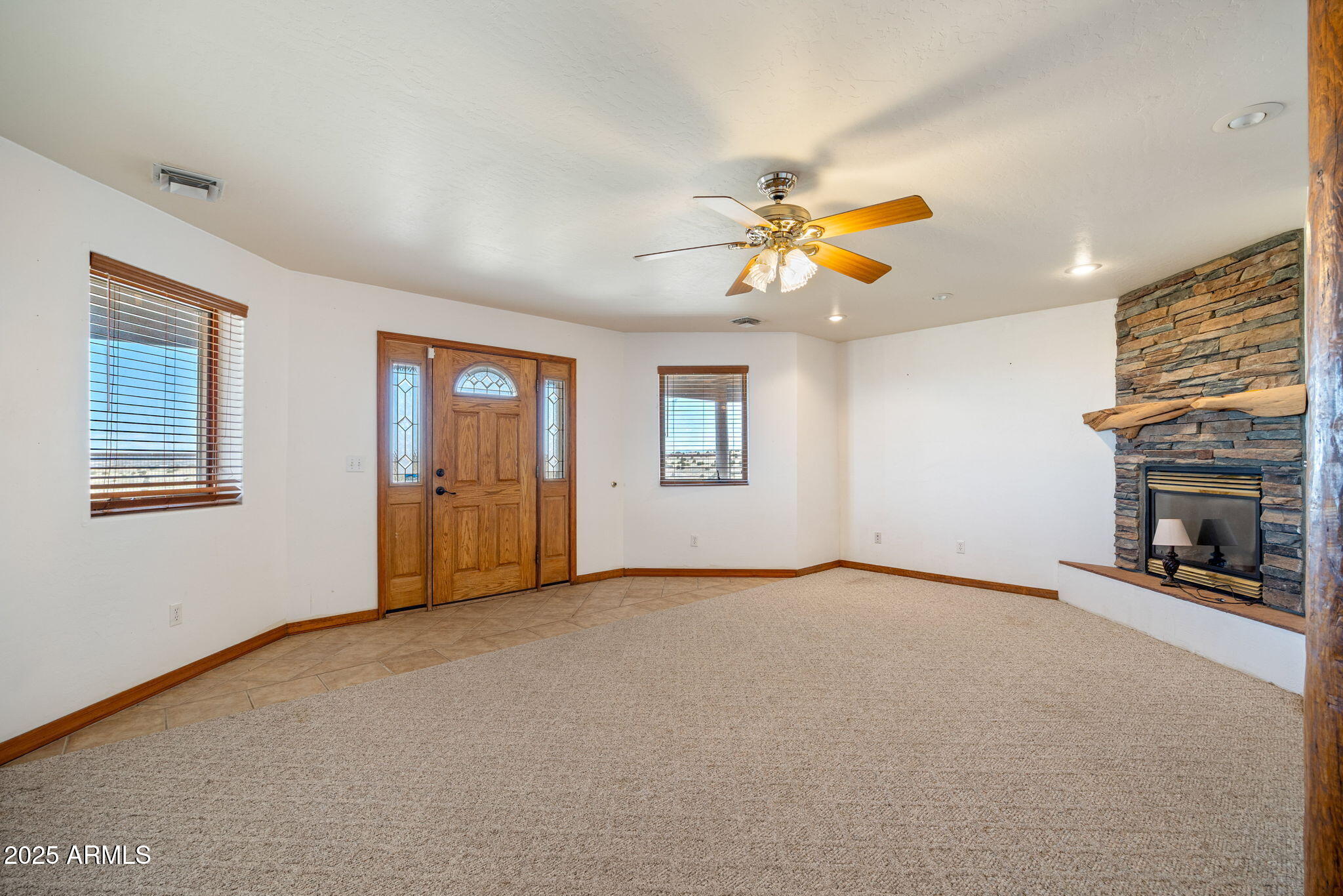 800 Arena Estates Taylor, AZ 85939 - Photo 29 of 50 a view of an empty room with a fireplace and a window