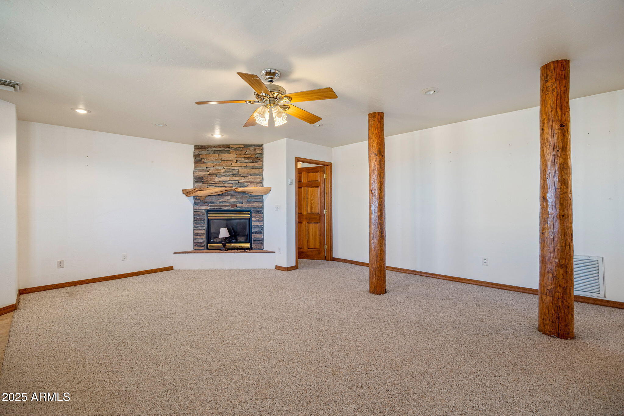 800 Arena Estates Taylor, AZ 85939 - Photo 31 of 50 a view of a livingroom with a fireplace