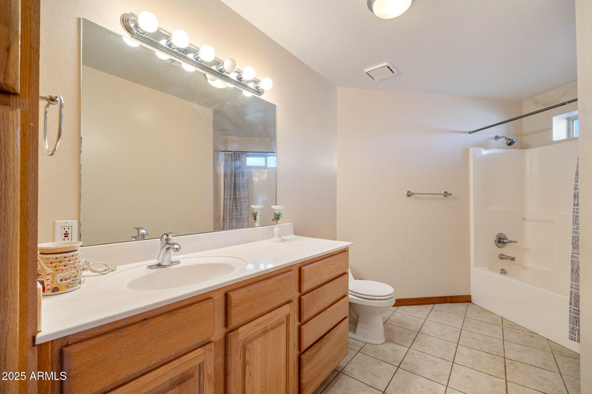 800 Arena Estates Taylor, AZ 85939 - Photo 34 of 50 a bathroom with a sink a toilet a mirror and shower