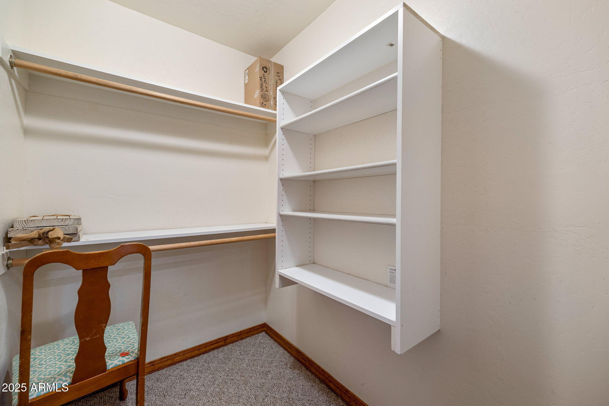 800 Arena Estates Taylor, AZ 85939 - Photo 37 of 50 a view of walk in closet with empty racks