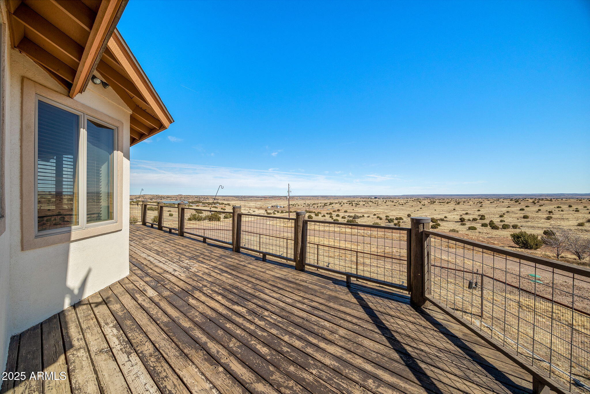 800 Arena Estates Taylor, AZ 85939 - Photo 5 of 50 a view of a balcony with wooden floor