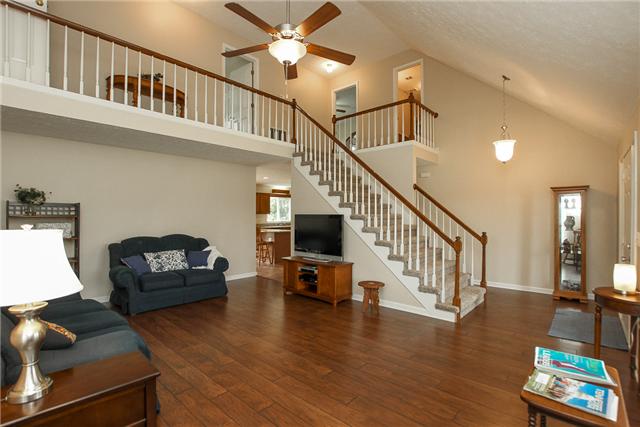 2021 Bradbury Road Adams, TN 37010 - Photo 6 of 20 Open great room with hardwood flooring
