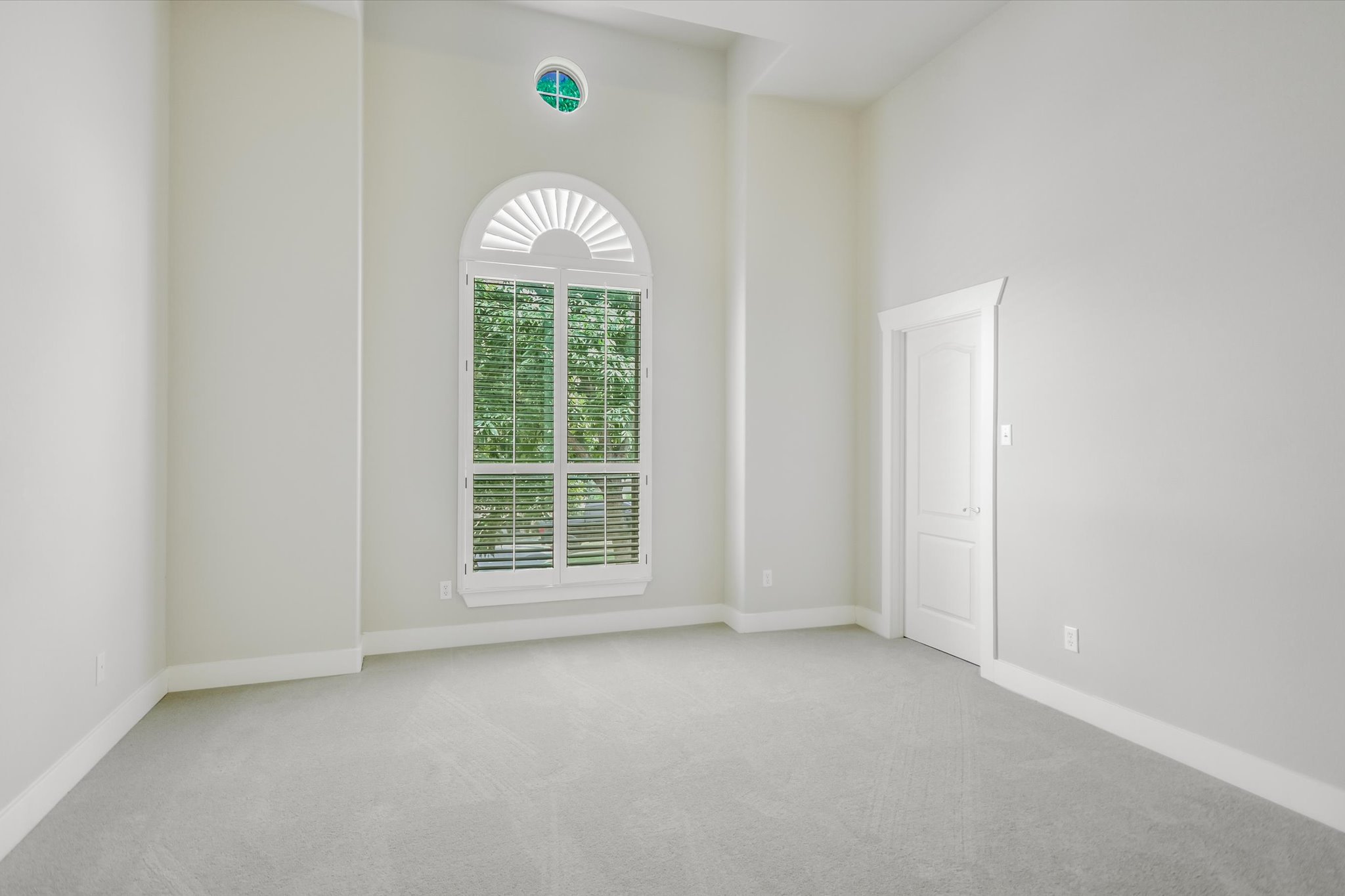 210 Rivulet Lane Austin, TX 78738 - Photo 16 of 20 Spare room with light colored carpet and a high ceiling