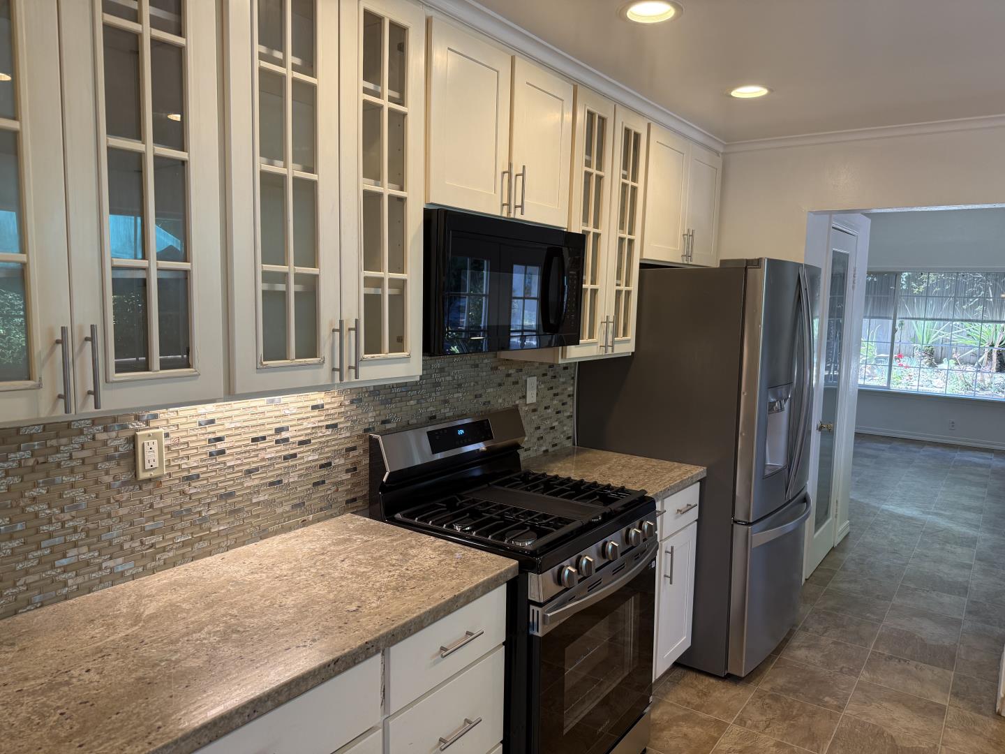40 Cathy Lane Scotts Valley, CA 95066 - Photo 6 of 14 a kitchen with stainless steel appliances granite countertop a stove and a refrigerator