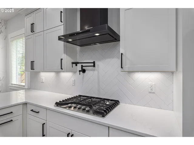 a kitchen with a stove and a cabinet