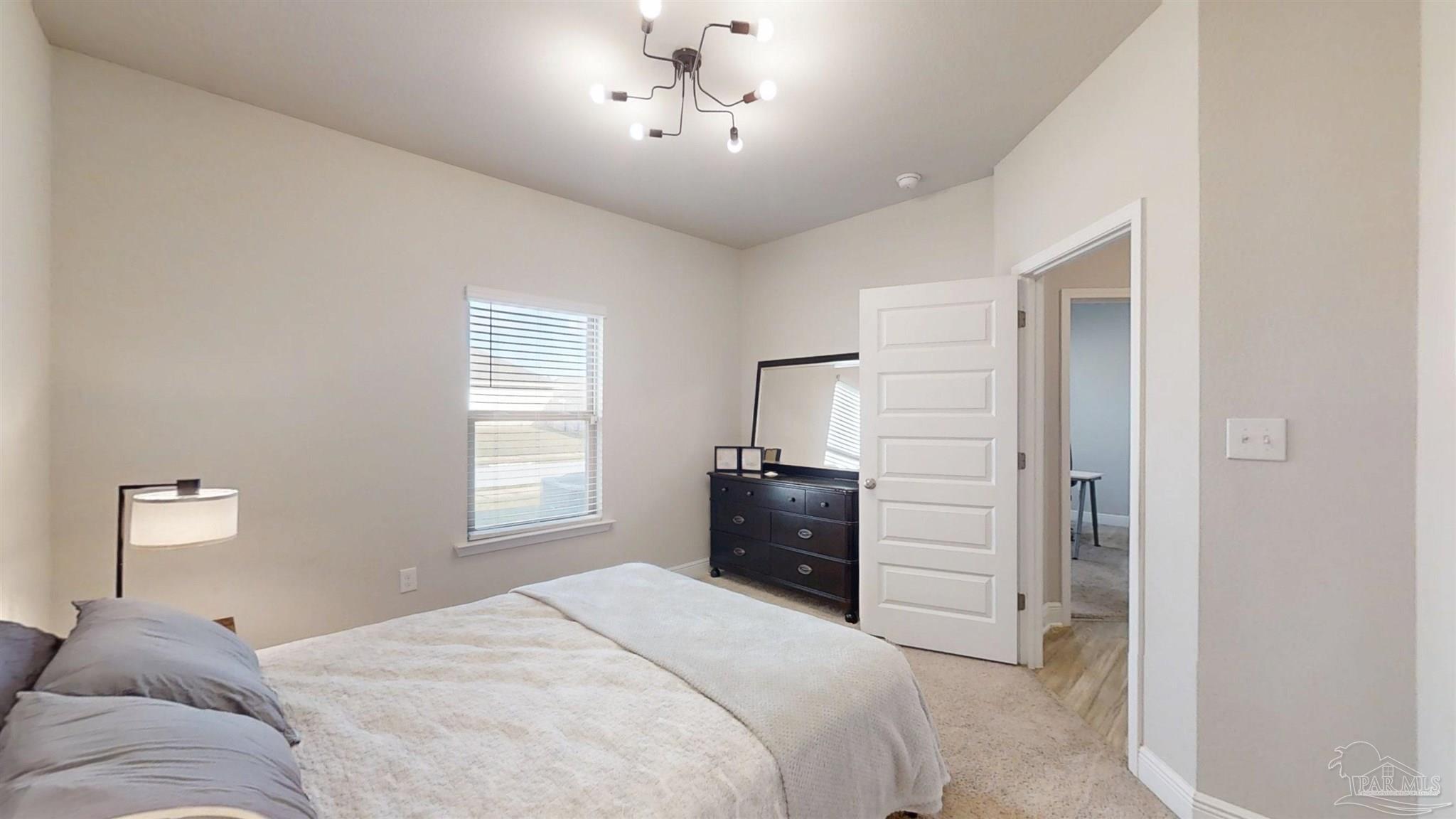 421 Apollo Avenue Gulf Shores, AL 36542 - Photo 13 of 72 a bedroom with a bed and a dresser