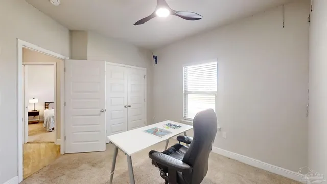 a large kitchen with a table and chairs