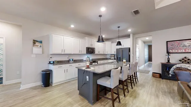 a bedroom with furniture and a window