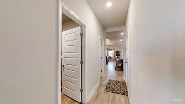 a view of closet area with empty room