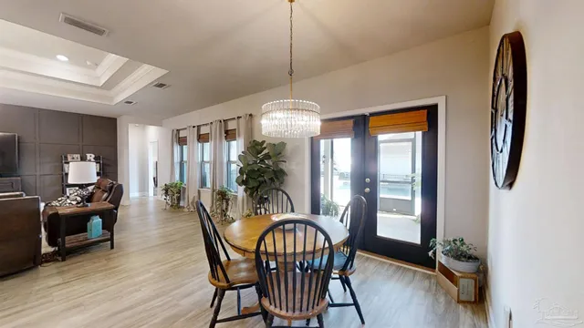 a bathroom with a granite countertop toilet sink and mirror