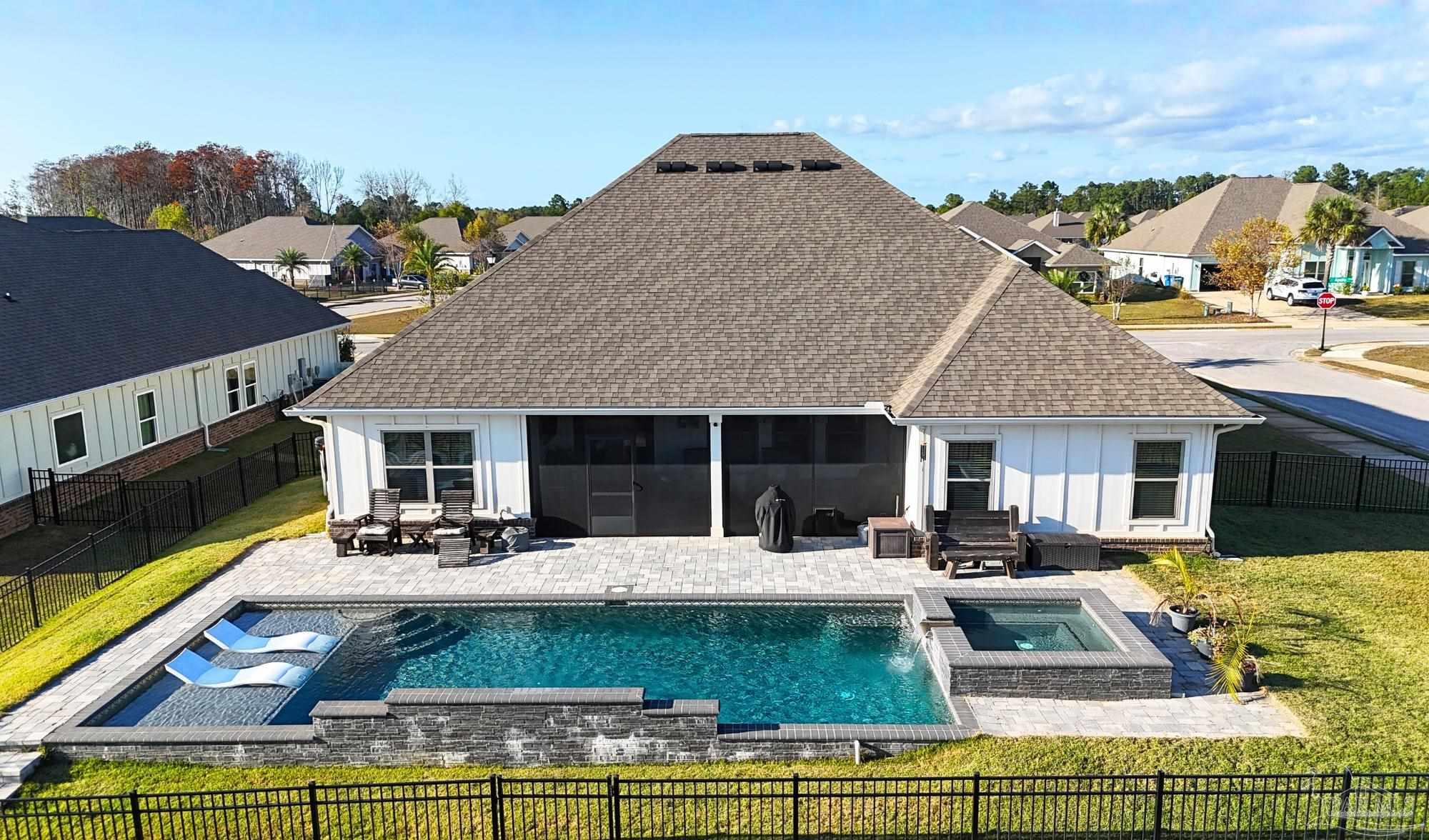 421 Apollo Avenue Gulf Shores, AL 36542 - Photo 4 of 72 a view of a house with swimming pool and sitting area