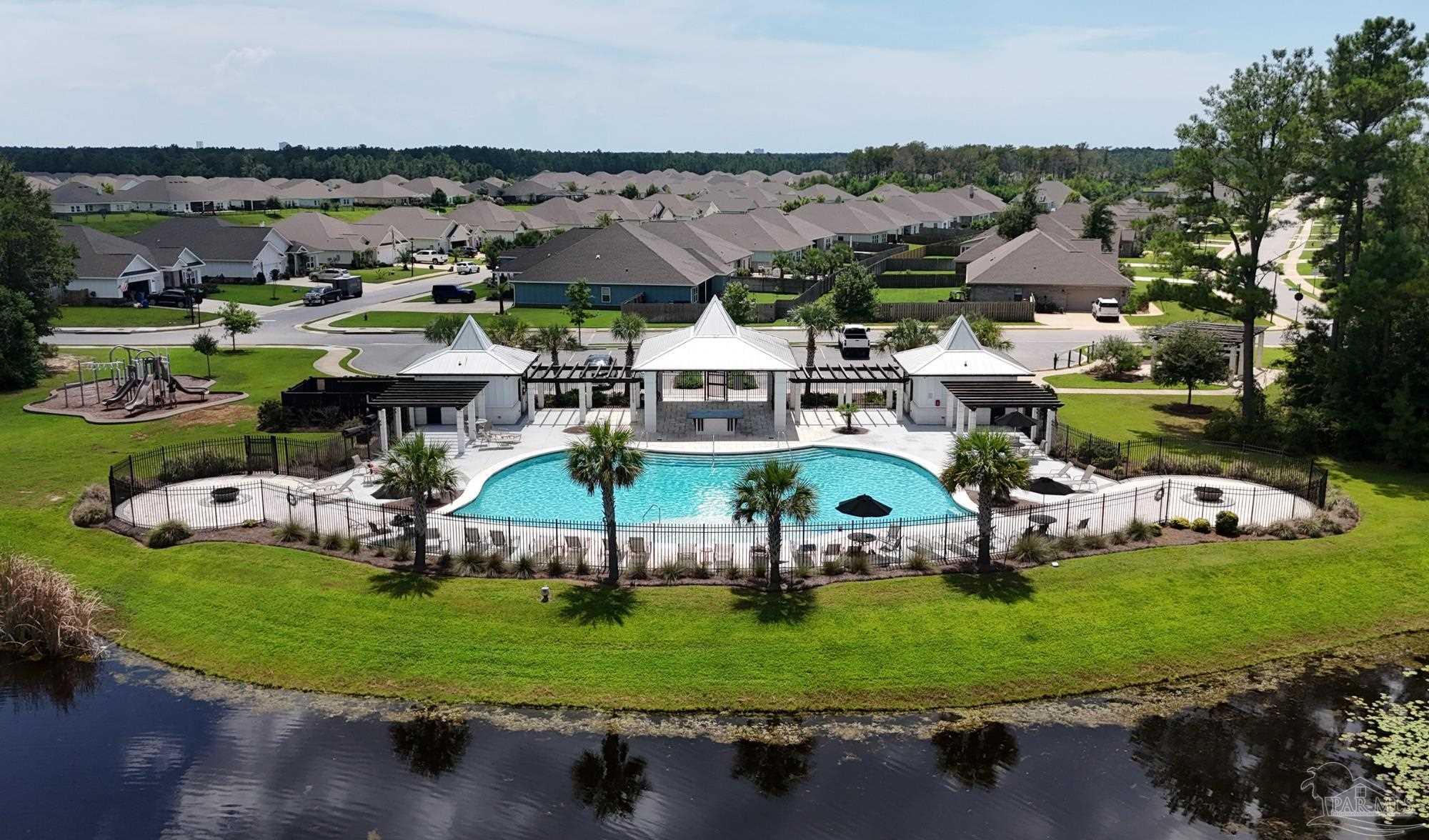 421 Apollo Avenue Gulf Shores, AL 36542 - Photo 70 of 72 an aerial view of a house with a garden and lake view