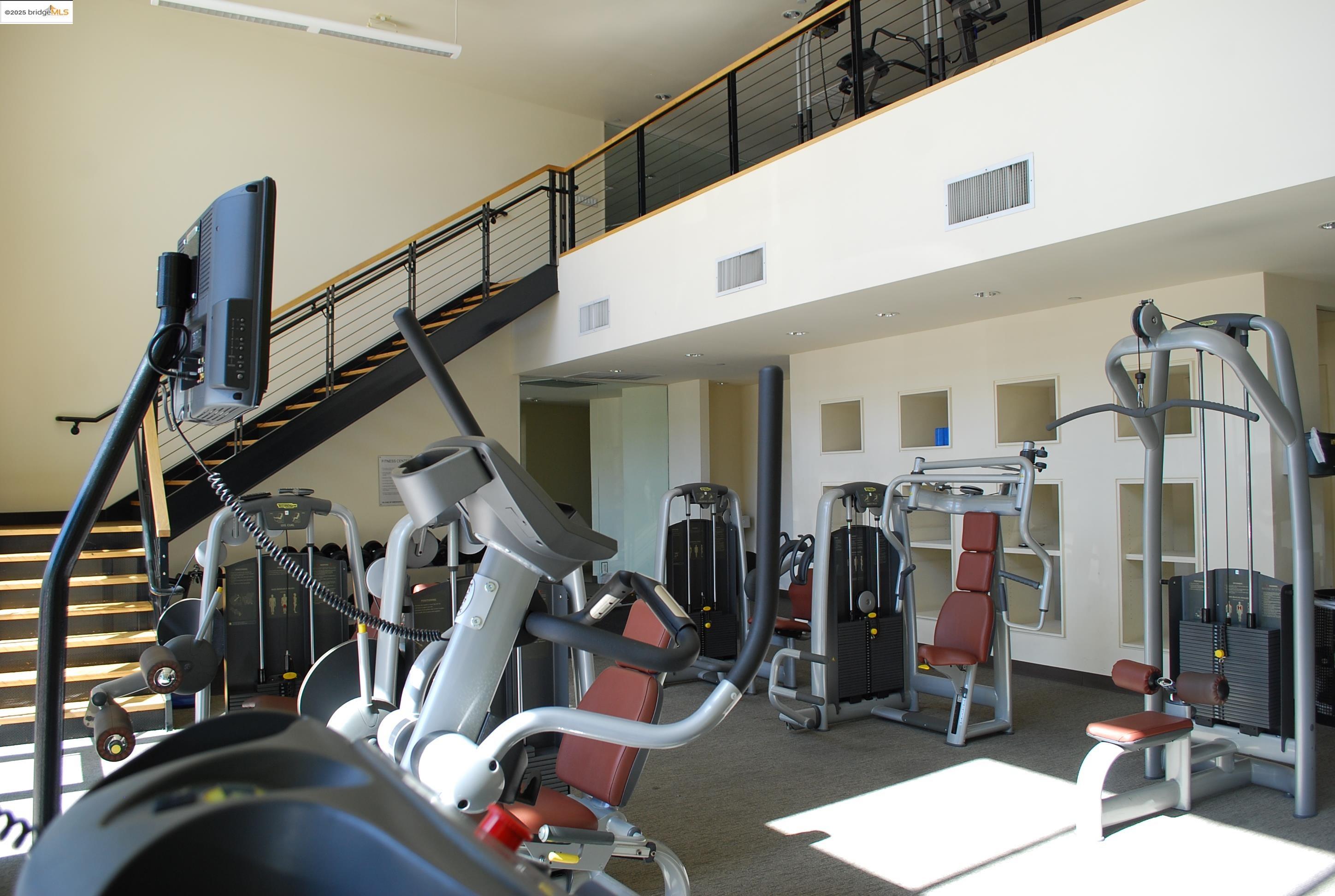 311 Oak Street, Unit 724 Oakland, CA 94607 - Photo 5 of 16 a view of a room with gym equipment