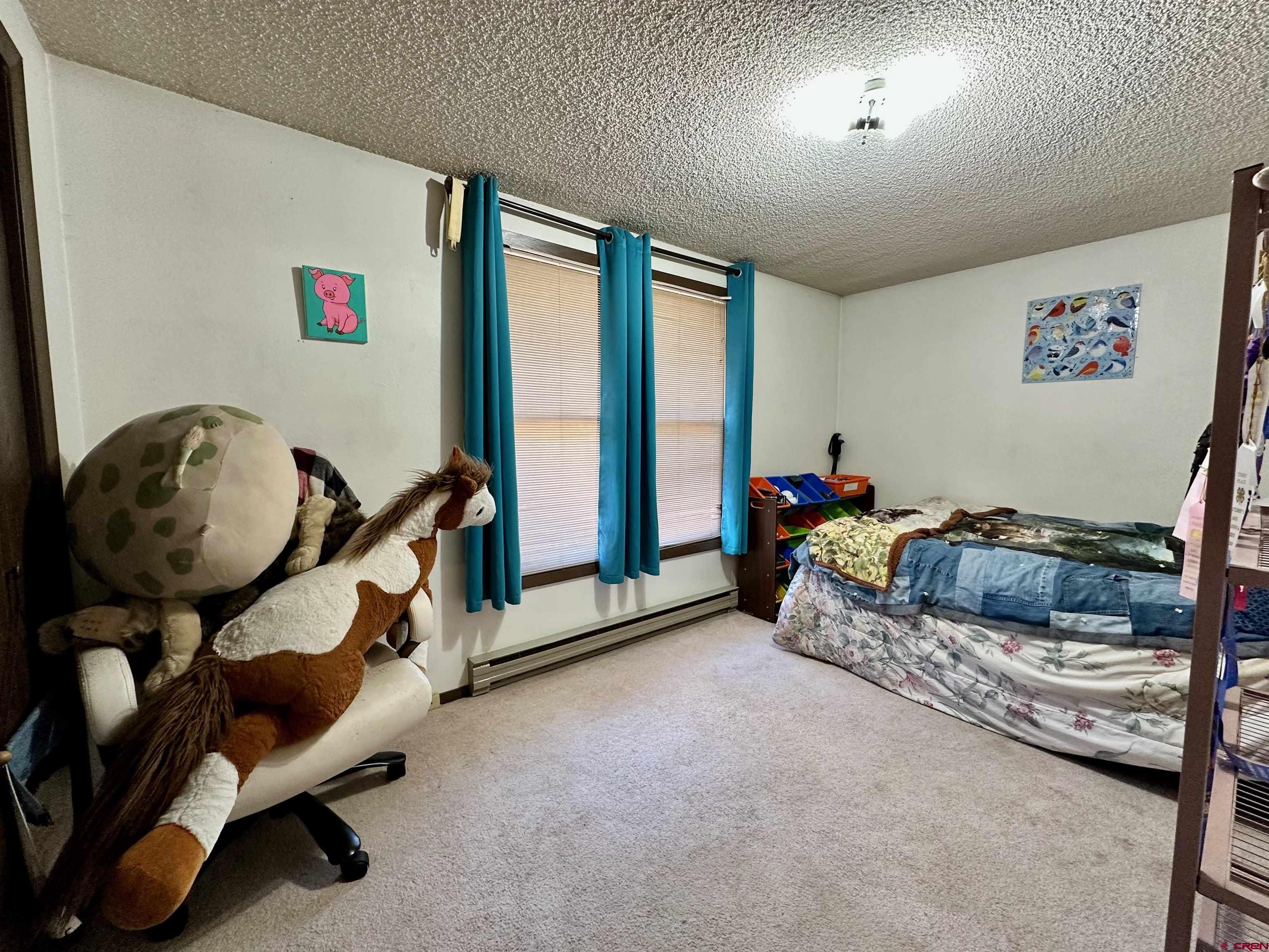 9437 County Road 76 Ohio City, CO 81239 - Photo 14 of 29 a bed room with a bed and a window