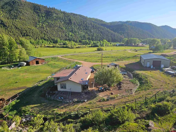 a view of a town with mountains in the background