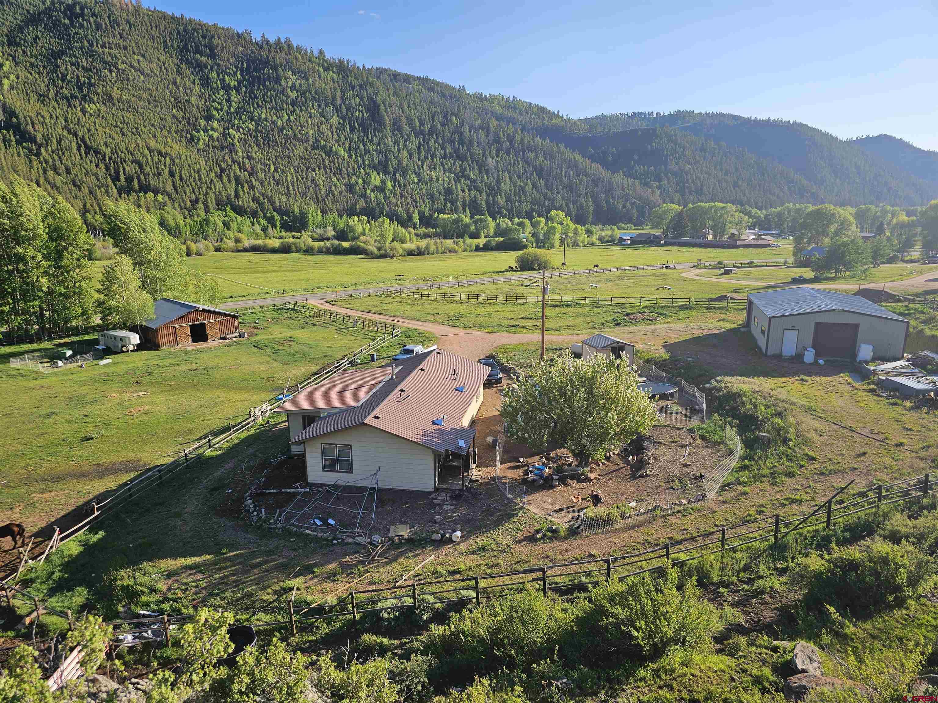 9437 County Road 76 Ohio City, CO 81239 - Photo 2 of 29 a view of a town with mountains in the background