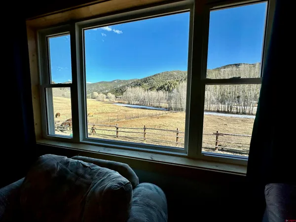 a bed sitting in front of a window