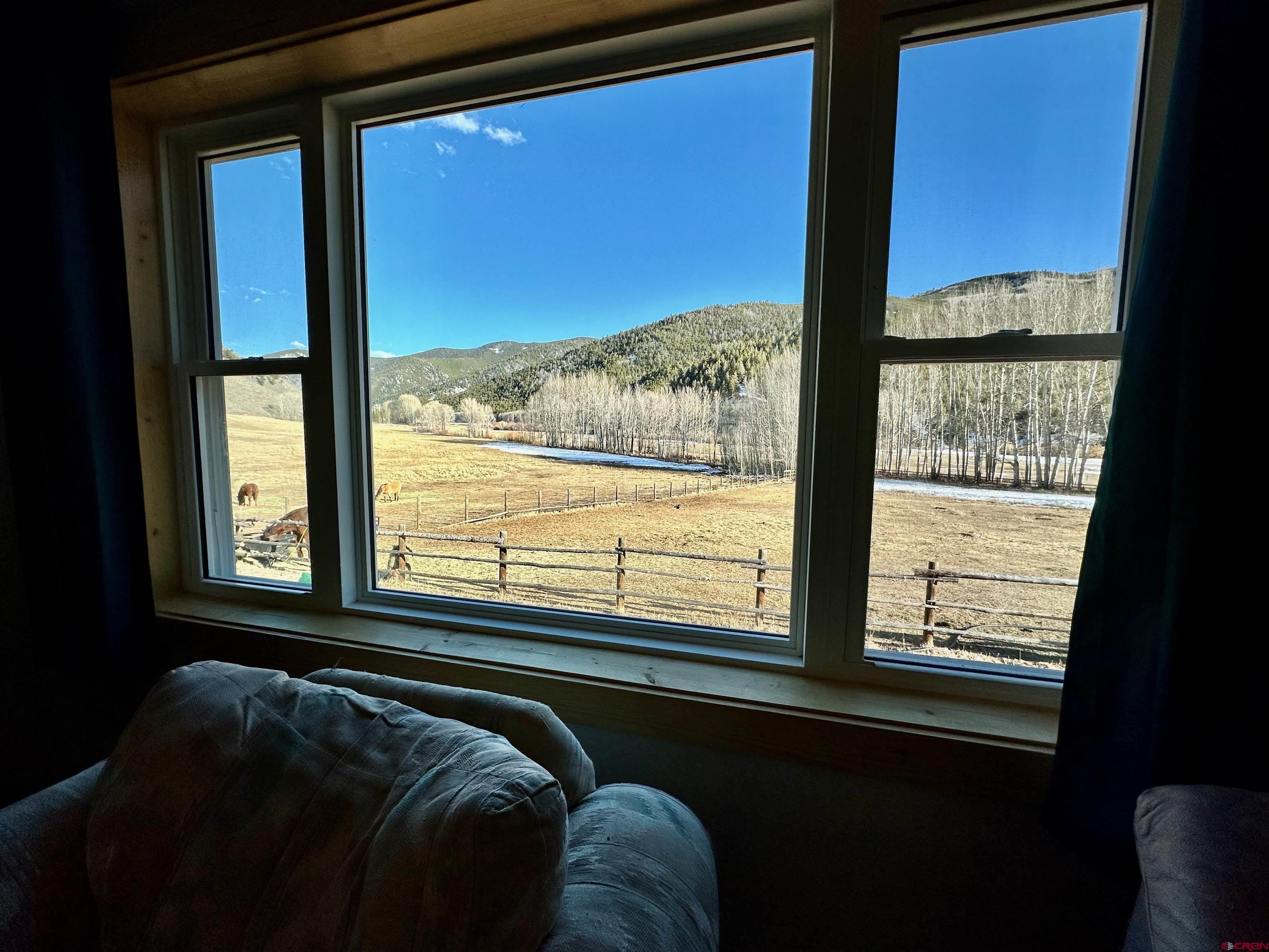 9437 County Road 76 Ohio City, CO 81239 - Photo 6 of 29 a bed sitting in front of a window