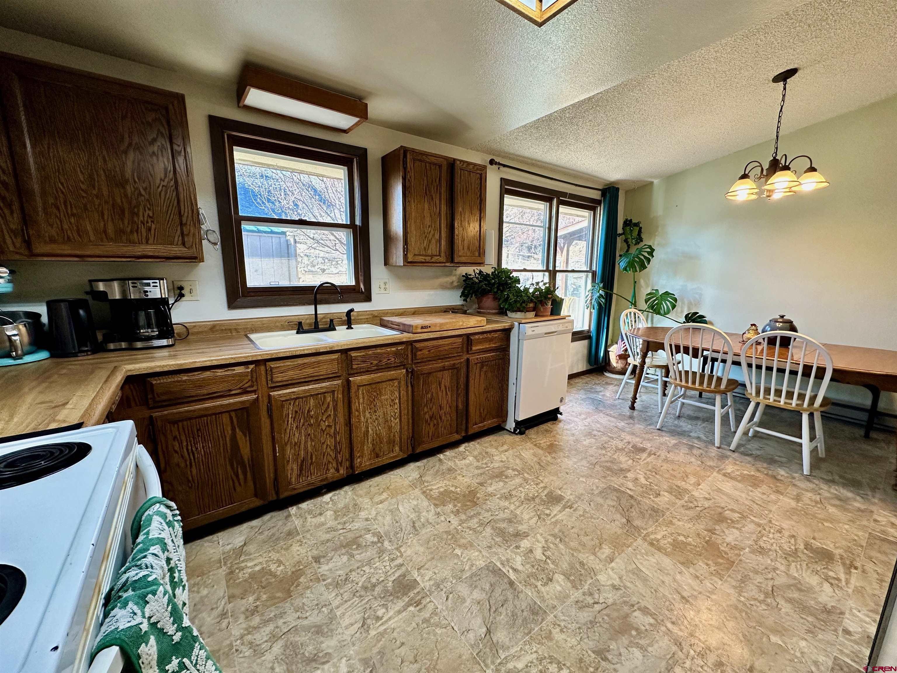 9437 County Road 76 Ohio City, CO 81239 - Photo 9 of 29 a kitchen with lots of counter top space and dining table